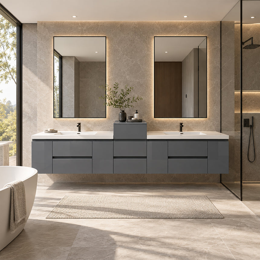 A modern floating double-sink bathroom vanity in light wood with white countertops and integrated mirrors, shown in a bright contemporary bathroom setting.
