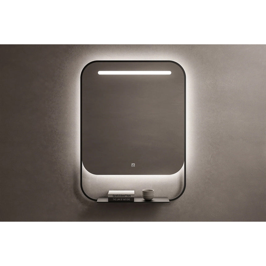 Bathroom mirror with LED lighting on a concrete wall.