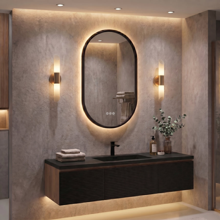 Bathroom mirror with LED lighting on a concrete wall.